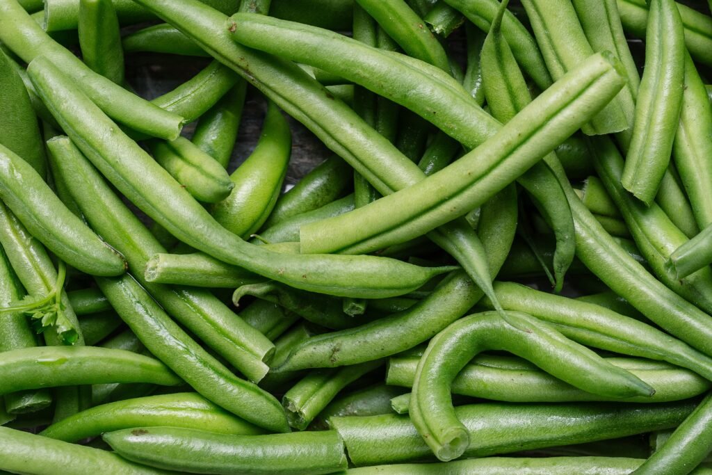 closeup shot of fresh raw green beans perfect for an article about vegetarian food
